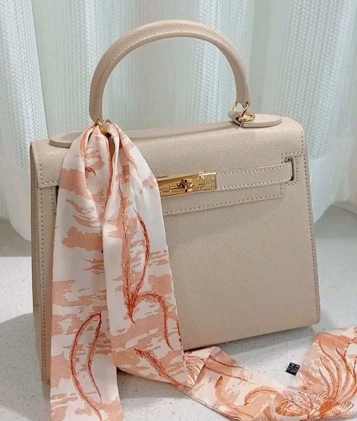 Home 5 A bag with scarf around the hand bag
